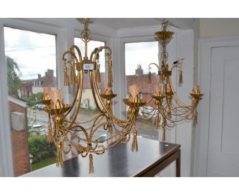 Pair of Christopher Wray gilt metal four light electroliers of scroll rope and swag design, 22ins high excluding ceiling rose