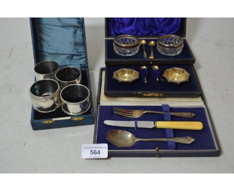 Three silver napkin rings, a plated napkin ring, cased silver and cut glass set of salts, a pair of silver salts cased and a 