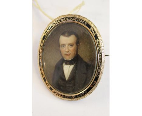 19th Century watercolour portrait miniature of a gentleman wearing a bow tie, in a yellow metal and black enamel mourning bro