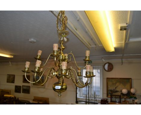 Christopher Wray brass twelve light electrolier in antique Dutch style, 21ins high excluding chain and ceiling rose 
