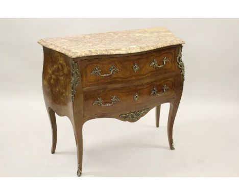 Small 20th Century French Kingwood inlaid and ormolu mounted commode, the rouge marble top above two drawers, raised on cabri