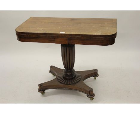 George IV mahogany rosewood crossbanded fold-over card table on fluted column and quadruped base (splits to top) 