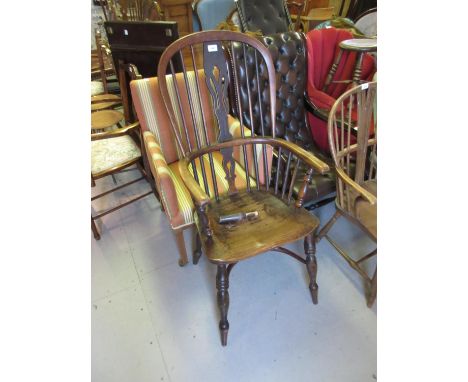 19th Century ash and elm Windsor elbow chair, the tall hoop, stick and pierced splat back above a carved panel seat, turned s