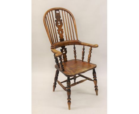 19th Century ash and elm Windsor chair, the hoop, stick and pierced splat back above a carved panel seat and turned supports 