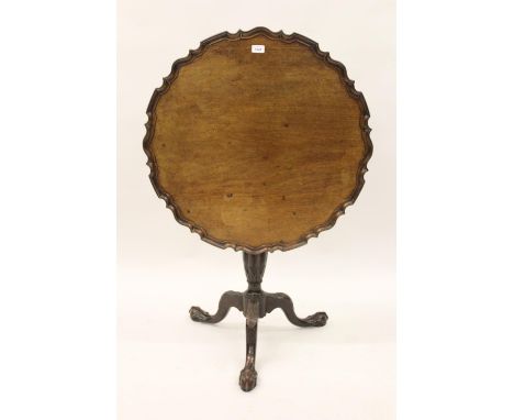 19th Century mahogany circular pedestal table in George III style, the shaped moulded tilt top above a turned and fluted whea