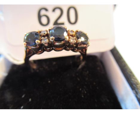 18ct Yellow gold ring set three sapphires and four small diamonds 