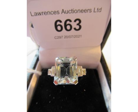 Platinum ring, set rectangular aquamarine flanked by baguette cut diamonds 