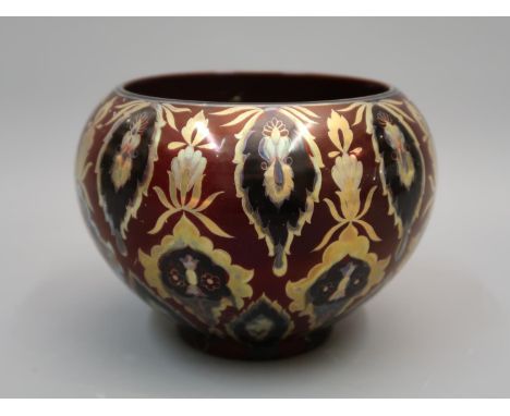 Zsolnay lustre jardiniere decorated with an all-over repeating design on a deep red ground, printed mark to base ' Unique pie