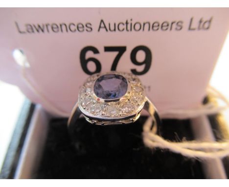 Platinum oval sapphire and diamond cluster ring 