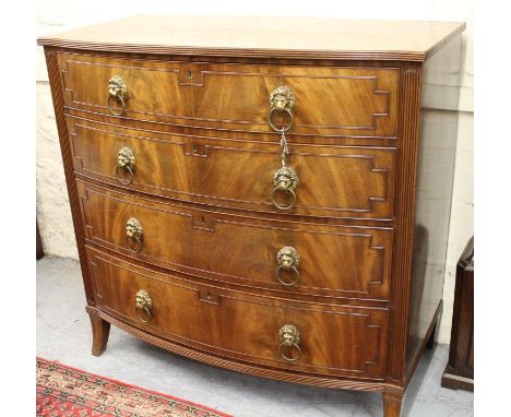 Regency mahogany semi bow front chest, the figured reeded top above four graduated and reed moulded drawers with gilt lion ri