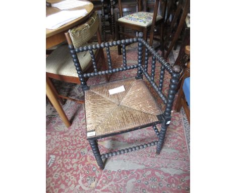 Late Victorian ebonised and bobbin turned corner chair with a rush seat, together with a late 19th Century walnut octagonal o