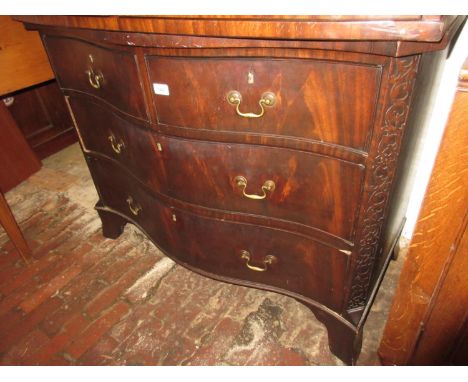 Early 20th Century mahogany serpentine fronted commode type chest in George III style, the crossbanded top above two short an