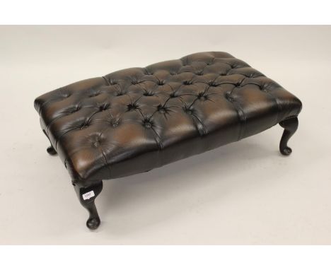 20th Century brown leather button upholstered large footstool on cabriole supports with pad feet, 12ins high x 22ins x 37ins,