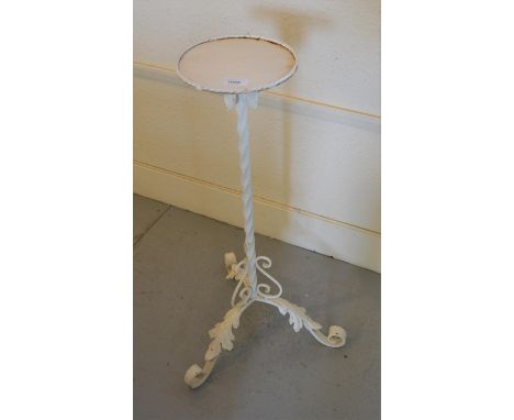 White painted wrought iron plant stand with spiral support and leaf form tripod base 