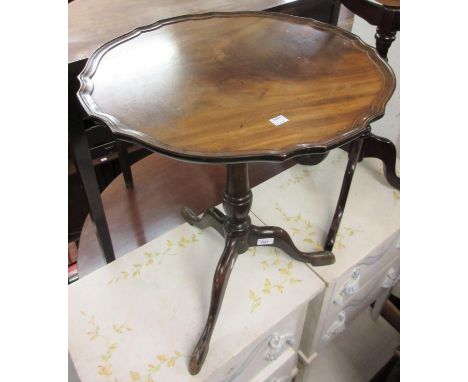 Mahogany wine table with shaped top and turned support with tripod base, together with a pair of similar smaller tables 