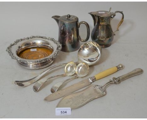 Continental white metal serving slice together with a 19th Century plated bottle stand, bread knife, ladle and other miscella