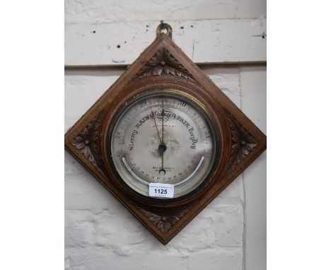 Carved oak aneroid barometer / thermometer by T. Armstrong, Manchester 