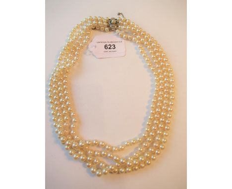 Four strand cultured pearl choker with a diamond and pearl set white and yellow metal clasp of Art Deco design, overall lengt