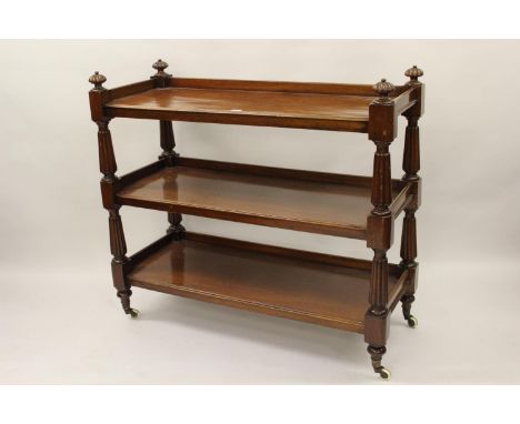 William IV mahogany three tier buffet with turned reeded supports and brass and ceramic casters, 45.5ins wideA few bumps and 