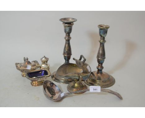 Pair of plated candlesticks, plated condiment set, plated ladle and a plated sugar scuttle 