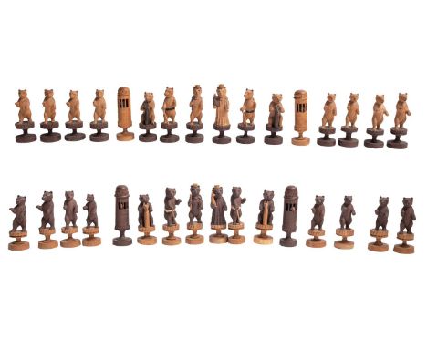 A Swiss carved and stained softwood Bears of Berne chess set, first half 20th century; the anthropomorphised animals portraye