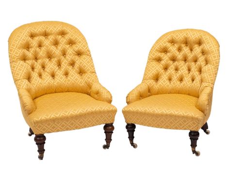 Two similar Victorian walnut frame nursing chairs, with curved upholstered stuff over button down backs, arm supports and bow