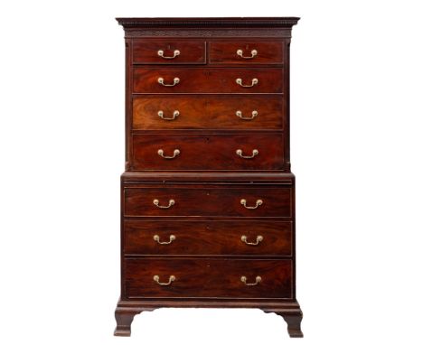 A George III mahogany chest on chest, circa 1770; the upper section with dentilled cornice and blind fretwork frieze in Chine