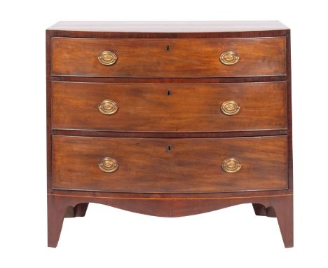 A George III mahogany and line inlaid bowfront chest of drawers, circa 1800; with three long graduated drawers and with a sha