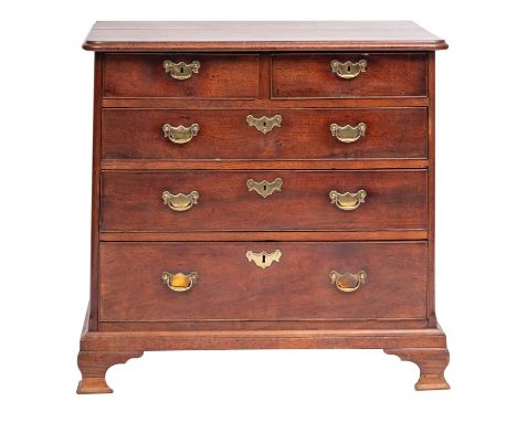 A mid 18th-century mahogany rectangular chest; the top with a moulded edge and rounded corners, with two short and three long