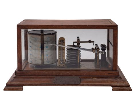 An Edwardian oak cased barograph with usual six-layer pump, ink bottle and spring-wound mechanism, the oak case with hinged t