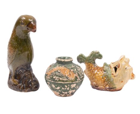 A group of two Chinese 'Diana Cargo' earthenware items and a similar small dragon jar in green, brown and yellow glazes compr