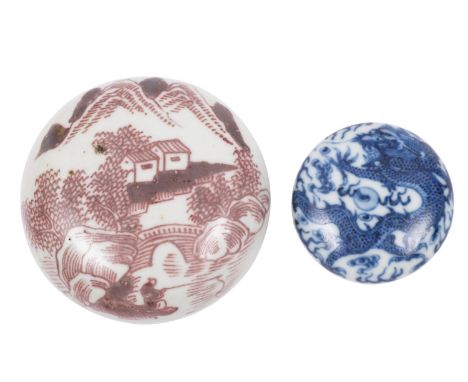 A Chinese copper-red seal paste box and cover and a smaller blue and white box and cover the first painted with buildings and