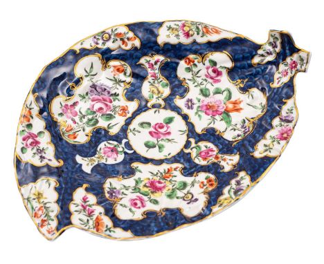 A First Period Worcester blue scale leaf-shaped dish painted with floral sprays within gilt edged foliate panels reserved on 
