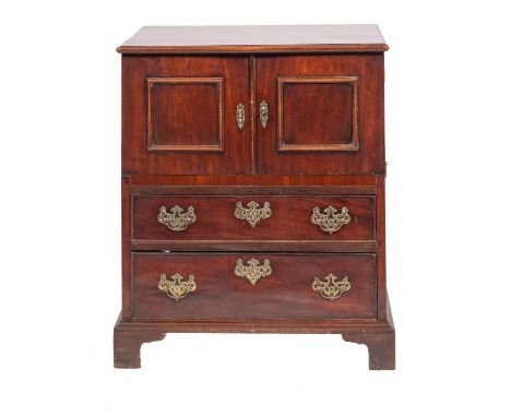 A George III mahogany adapted commode chest; enclosed by a pair of moulded panel doors, with two later drawers below, with br
