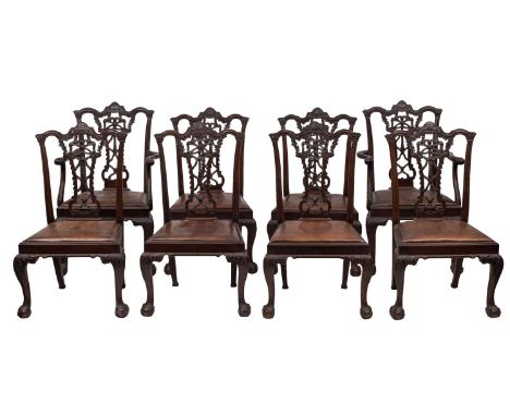 A set of eight carved stained beechwood dining chairs in the Chippendale style, late 19th century; the backs with shaped and 