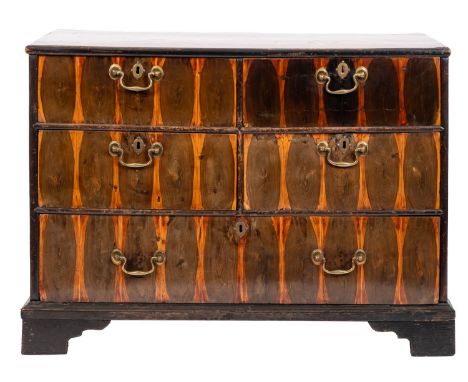 A George II oyster laburnum chest of drawers; the inlaid top above four short and one long drawer, with brass swing handles a