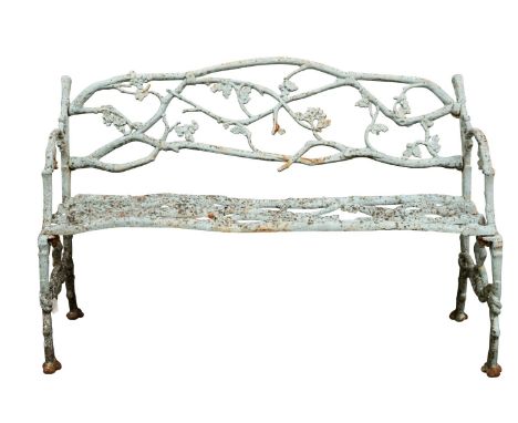A Victorian cast iron Oak Tree pattern garden seat, probably Coalbrookdale, third quarter 19th century; the openwork backrest