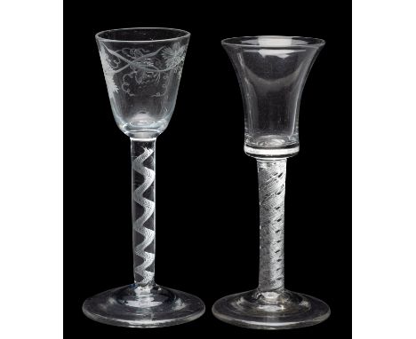 Two air twist wine glasses, the first with rounded funnel bowl engraved with fruiting vine and a bee on a straight stem conta