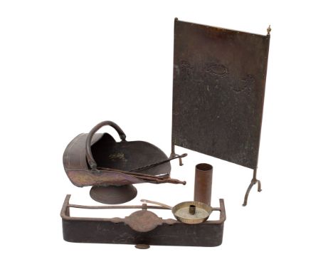 A small quantity of domestic metalware, 19th century; comprising an iron trivet fender, a copper scuttle, a repousse copper f