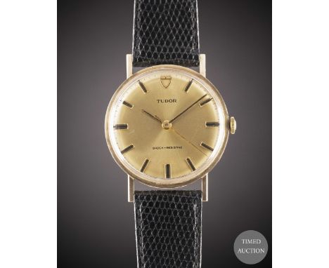 A GENTLEMAN'S 9CT SOLID GOLD ROLEX TUDOR SHOCK RESISTING WRIST WATCH
CIRCA 1969, WITH CHAMPAGNE DIAL, ACCOMPANIED BY ORIGINAL