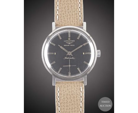 A GENTLEMAN'S STAINLESS STEEL LONGINES GRAND PRIZE AUTOMATIC WRIST WATCH
CIRCA 1960, WITH GLOSS BLACK GILT DIAL
Movement:&nbs