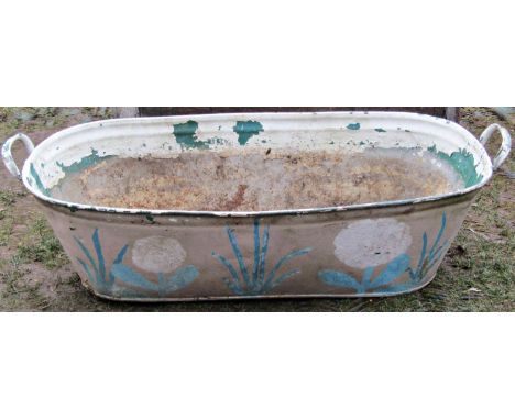 A vintage oval galvanised two handled bath with later painted finish and adapted as a planter, 118 cm long x 54 cm wide 