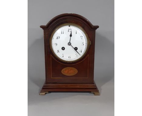 An inlaid Edwardian mahogany mantel clock with convex enamelled dial, French eight day striking movement striking on a gong, 