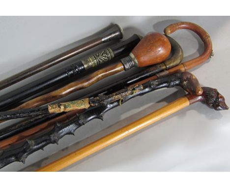 An Irish blackthorn prickly walking stick and six other varying walking sticks and a souvenir shillelagh (8) 