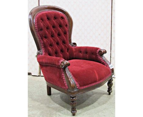 A reproduction Victorian style child/dolls size spoon back drawing room chair with upholstered seat, button back and arms wit