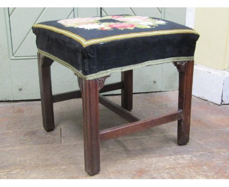 A Georgian mahogany centre stool of square cut form, with hand worked tapestry top, raised on four square moulded supports, 4