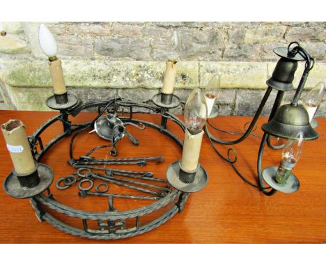An antique style cast metal hanging ceiling light of circular open ring form supporting four candle bulb fittings/sconces, 48