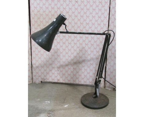 A vintage anglepoise table lamp with disc shaped platform base and racing green colourway 