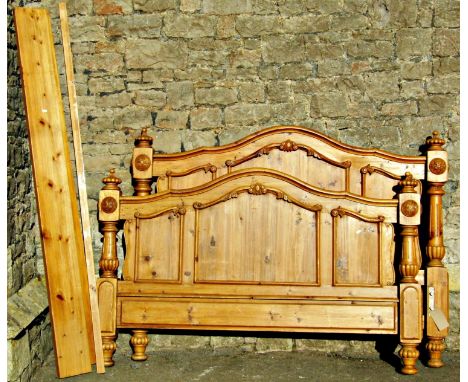 A matched suite of stripped pine bedroom furniture in the Victorian style, comprising double bedstead, the moulded arched hea