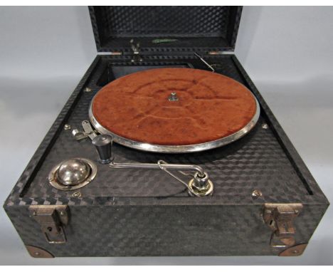 A portable wind-up record player 